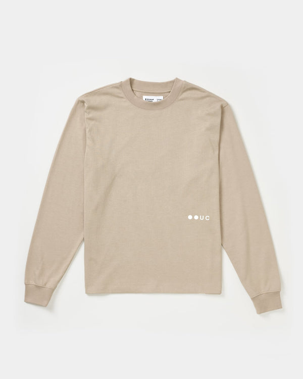 Unisex Long Sleeve Tee in Oatmeal, flatlay front view with crew neck, dropped shoulders and tonal UC chest logo.