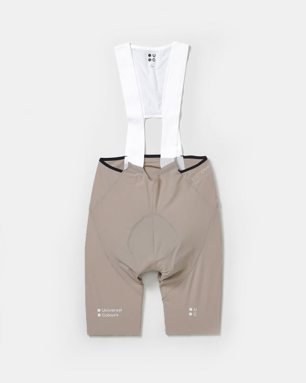 Men's Chroma Bib Short in Moon Grey, flatlay: warm taupe shorts with white mesh bib upper and contrast chamois stitch.