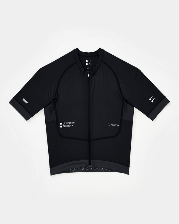 Men's Chroma Short Sleeve Jersey in Black, flatlay: full-length zip, white UC sleeve logo and dotted gripper hem.