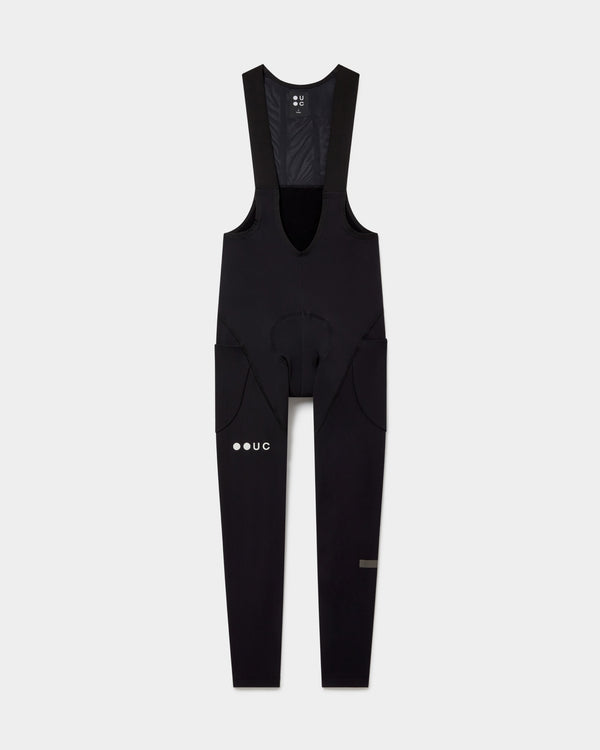 Men's Mono Cargo Bib Tight in Black, front flatlay showing mesh bib straps, integrated chamois and side thigh cargo pockets.