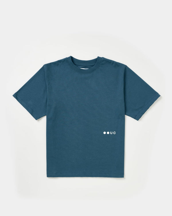 Unisex Short Sleeve Tee in Stone Blue, front flatlay, relaxed crew-neck cut with white UC dot logo printed at the front hem.