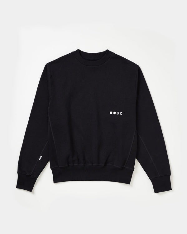 Unisex Sweatshirt in Charcoal Black, front flatlay: ribbed crew neck, side panel ribbing and tonal white UC chest logo.