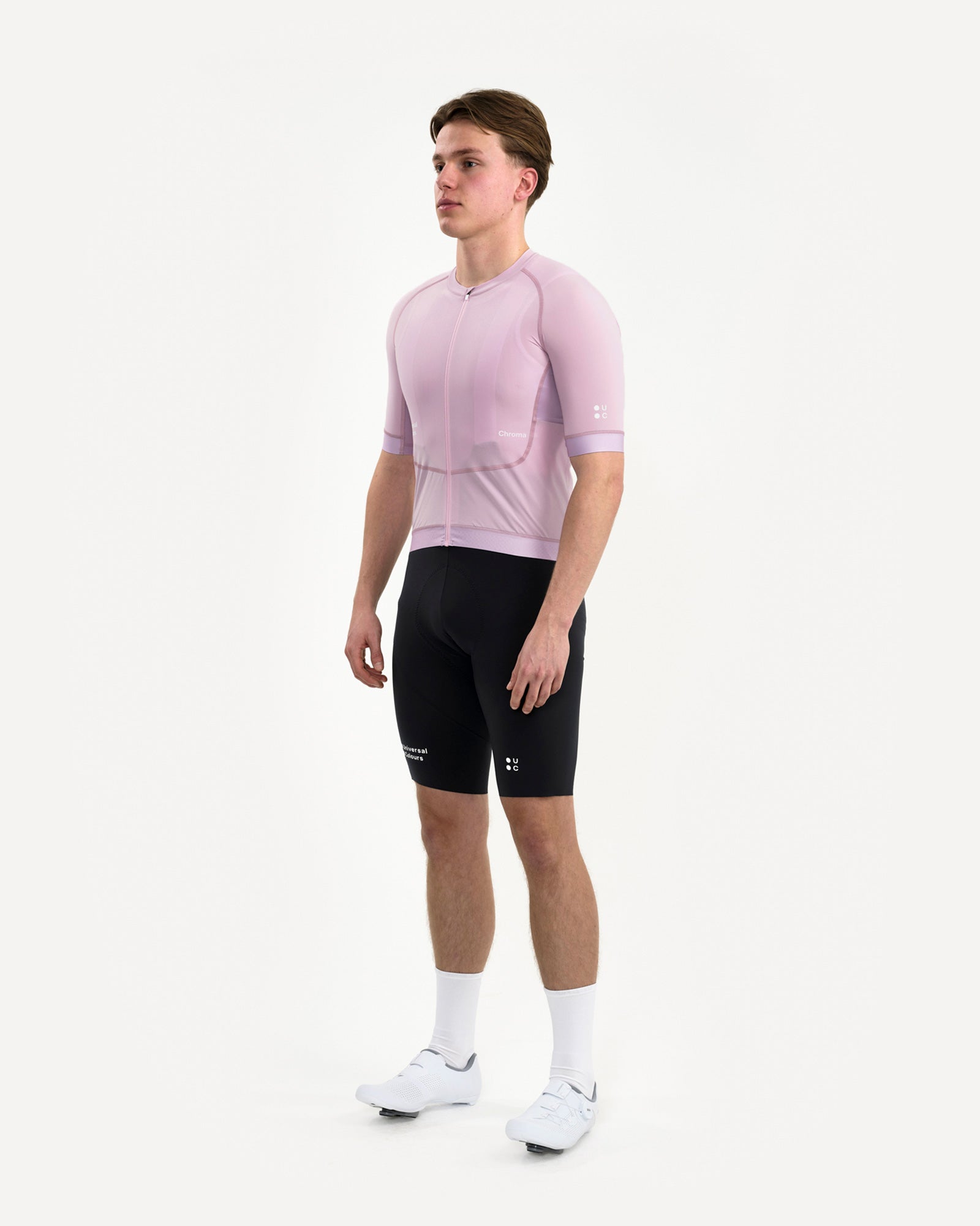 Front three-quarter view of the Men's Chroma Short Sleeve Jersey in Washed Lilac, paired with black UC bib shorts.