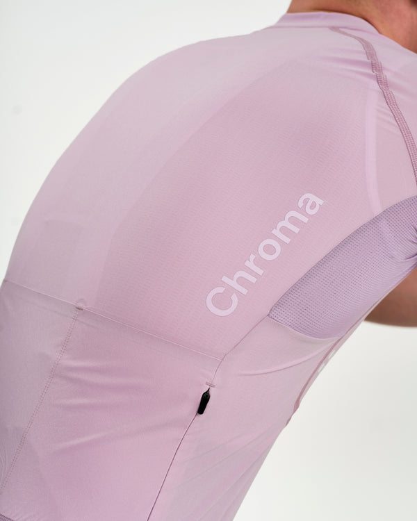 Side detail: tonal Chroma wordmark on the lower back and zipped rear pocket of the Washed Lilac Chroma Short Sleeve Jersey.