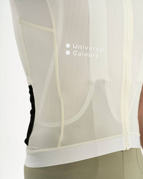 Side panel detail: tonal Universal Colours wordmark on the sheer mesh ventilation insert of the Tampered White jersey.