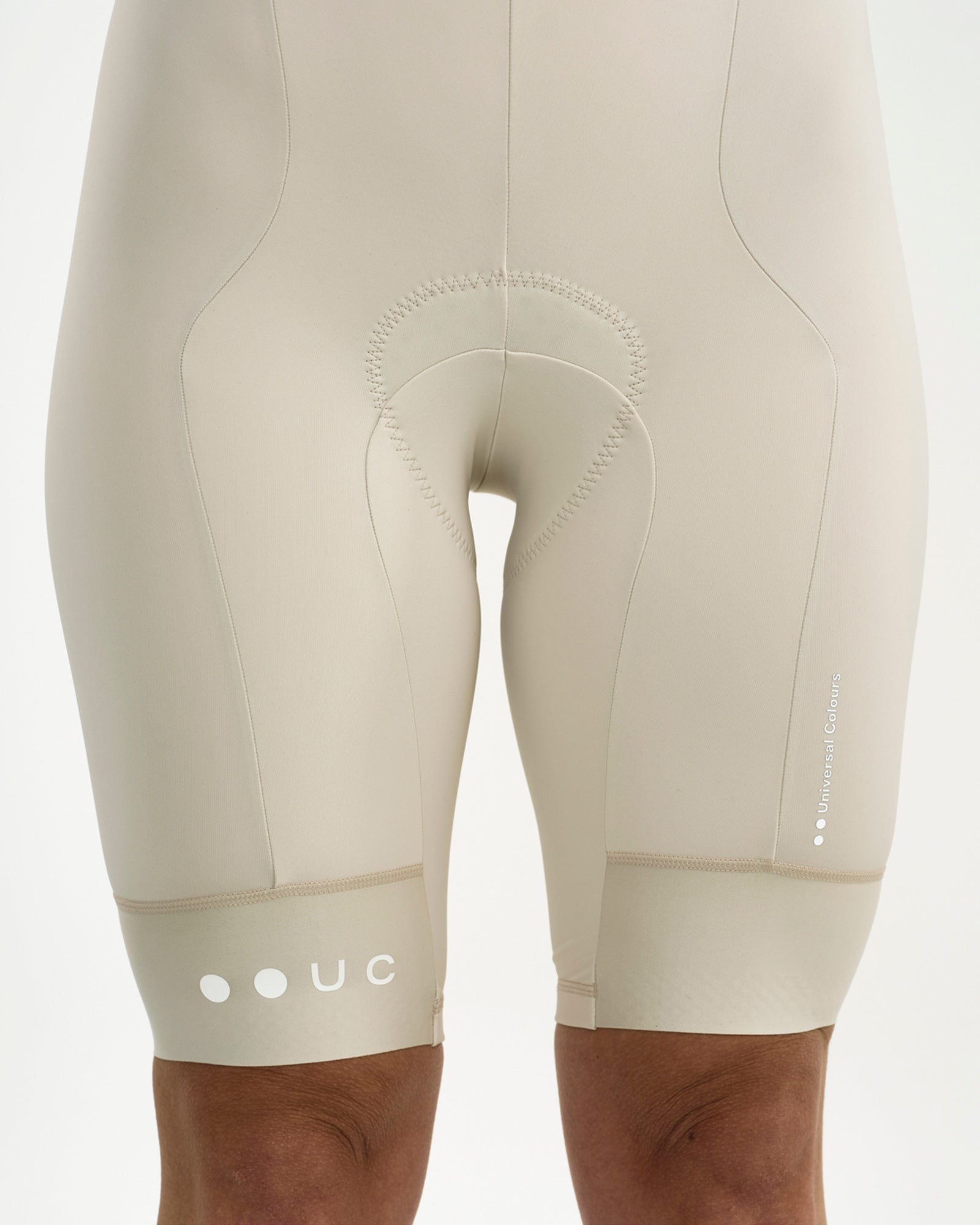 Close-up of the embossed chamois, bonded hem and tonal Universal Colours wordmark on the Off White Mono Bib Shorts 2.0.