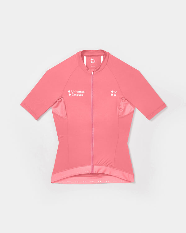 Flat-lay front view of the Women's Mono Short Sleeve Jersey in Pink: high collar, full-length zip, twin UC chest logos.