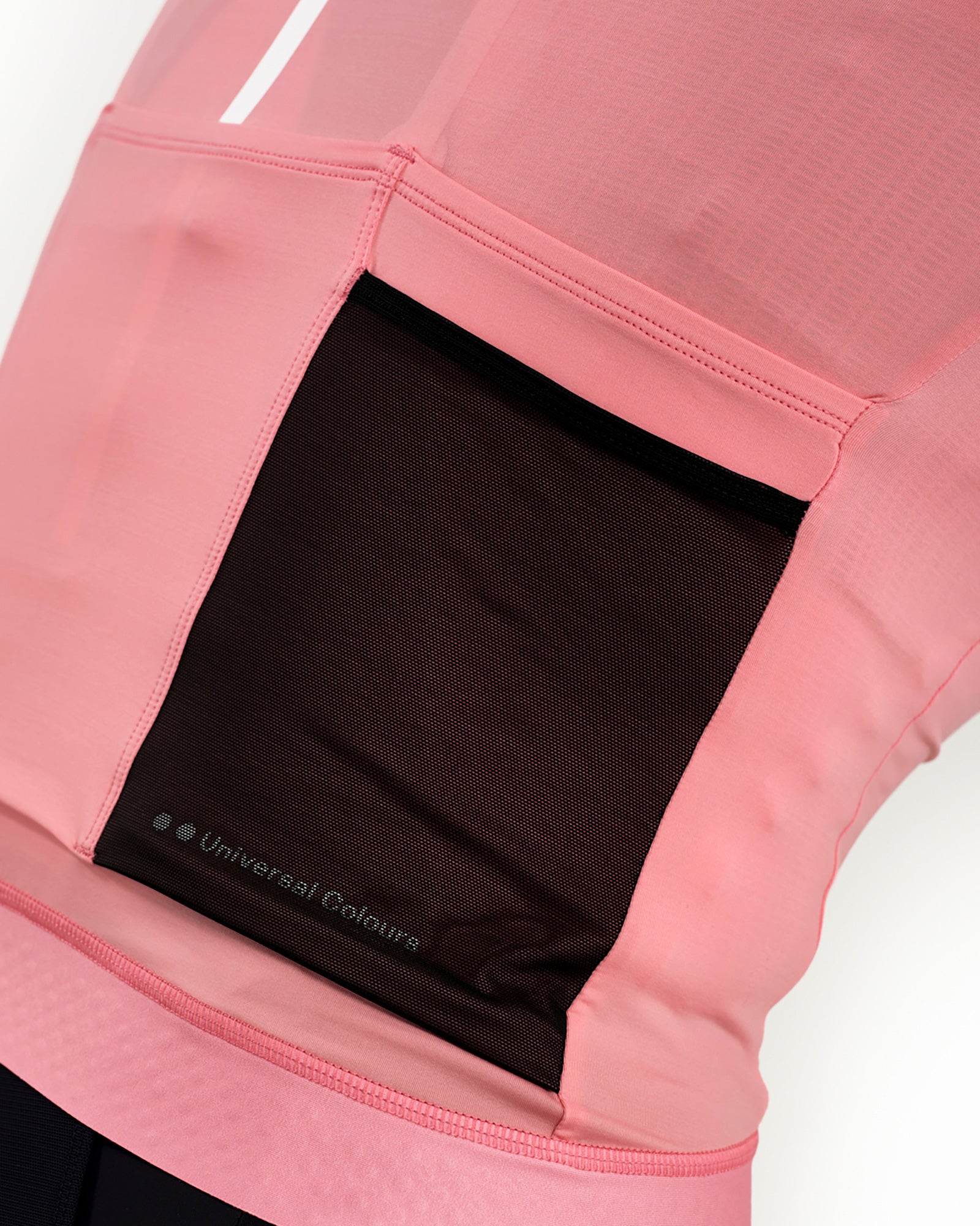 Zipped rear valuables pocket on the Women's Mono Short Sleeve Jersey in Pink, with tonal Universal Colours wordmark.