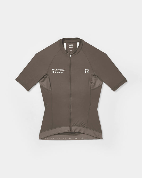 Flatlay front: Women's Mono Short Sleeve Jersey in Soft Grey with full-length zip, side mesh panels and dropped tail hem.