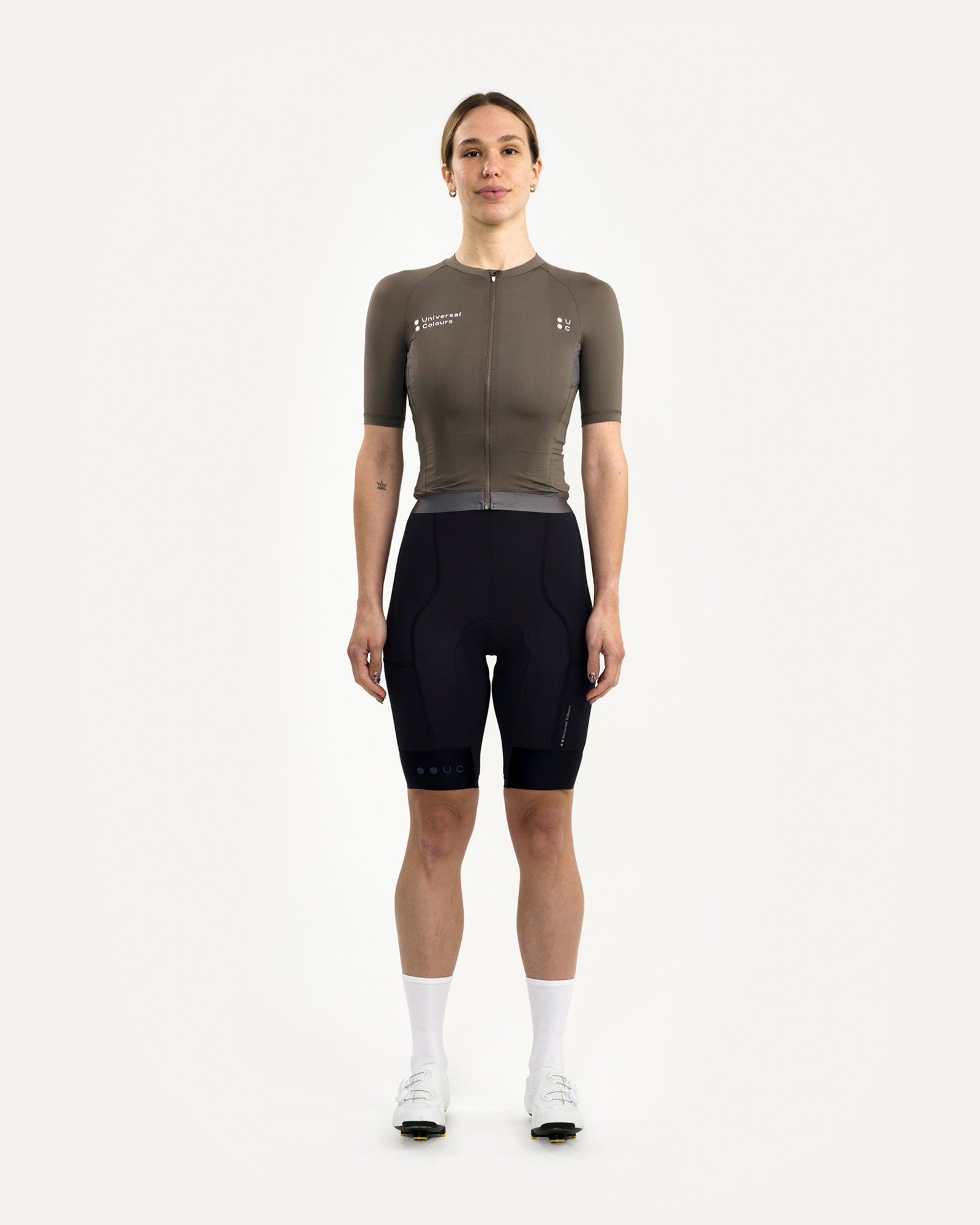 Women's Mono Short Sleeve Jersey in Soft Grey, front view on model, paired with black UC bib shorts and white road shoes.