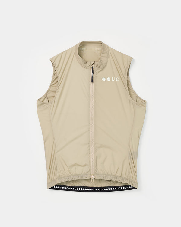 Flatlay of the Women's Mono Gilet 2.0 in Rice Beige: full-length zip, tonal UC chest logo and 'uc' wordmark hem tape.