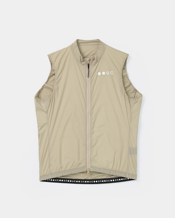 Men's Mono Gilet in Rice Beige, flatlay front view: full-length zip, tonal UC chest logo and perforated mesh collar panel.
