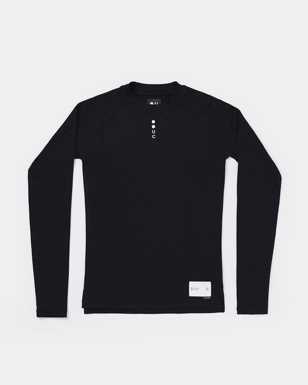 Flatlay: Men's Thermal Base Layer in Black, grid-fleece fabric with raglan sleeves and tonal UC chest logo.