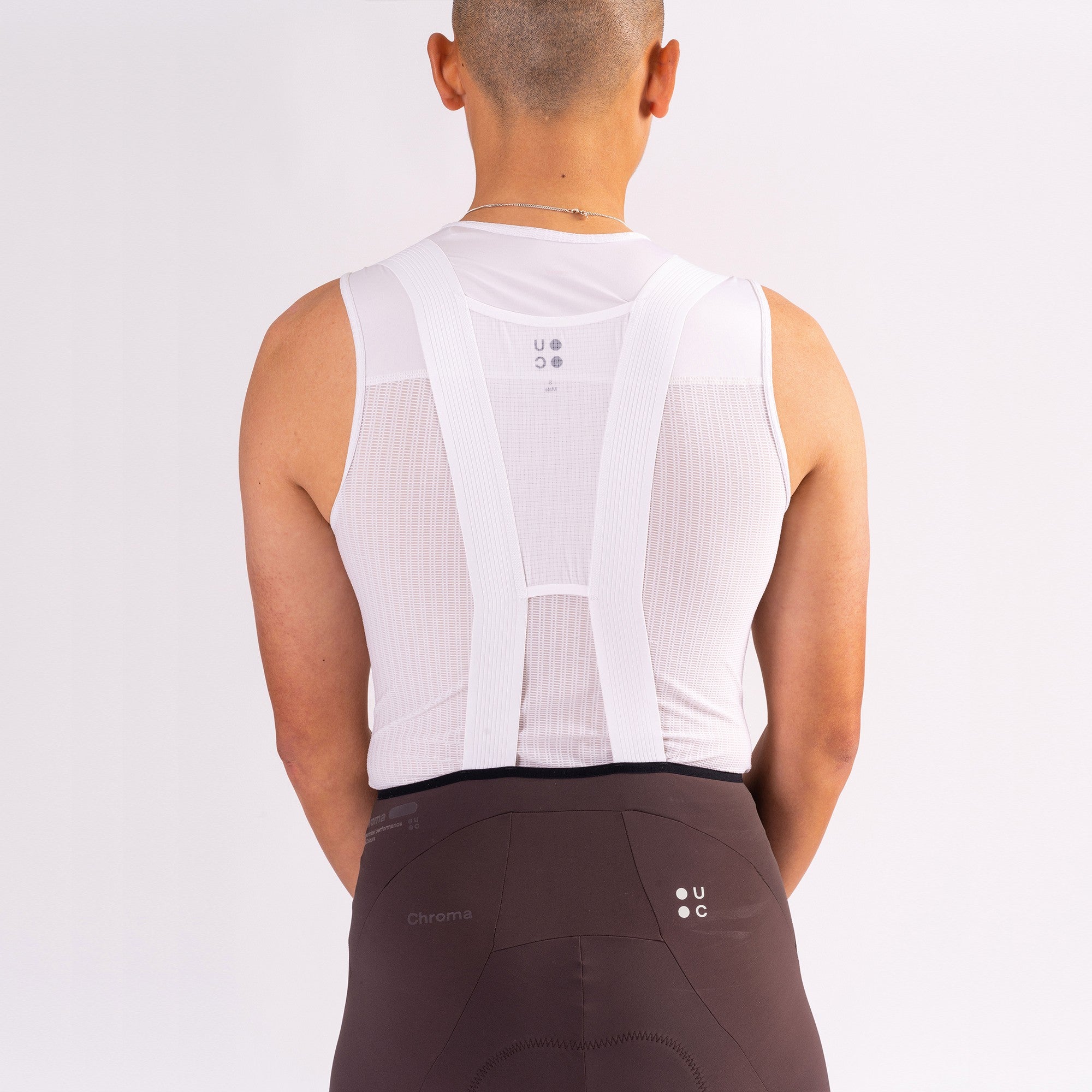 Bib detail: white mesh Y-back straps over the Heavy Bark Brown Chroma waistband with tonal Chroma wordmark.
