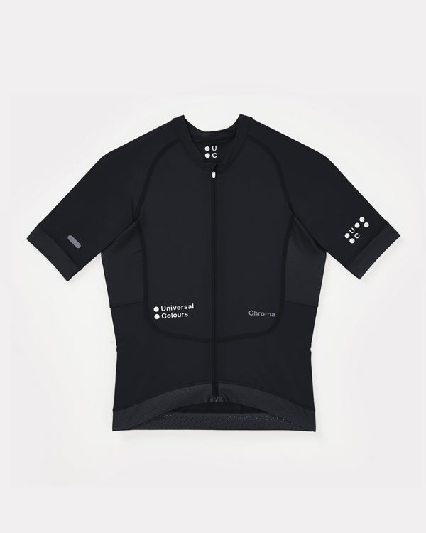 Flatlay of the Women's Chroma Short Sleeve Jersey in Black: full-length zip, tonal UC chest logo and mesh side panels.