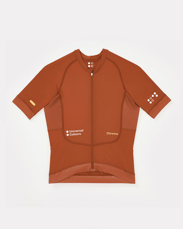 Women's Chroma Short Sleeve Jersey in Cyprus Copper, flatlay: full-length zip, raglan sleeves and tonal UC chest logos.