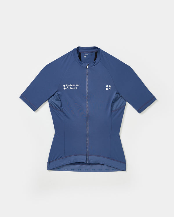 Flatlay: Women's Mono Short Sleeve Jersey in French Blue, full-length zip, mesh side panels and silicone hem grippers.