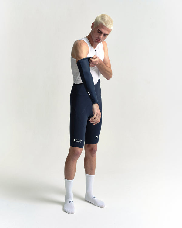 Model in the Arm Warmers in Eclipse Navy, full-length view.