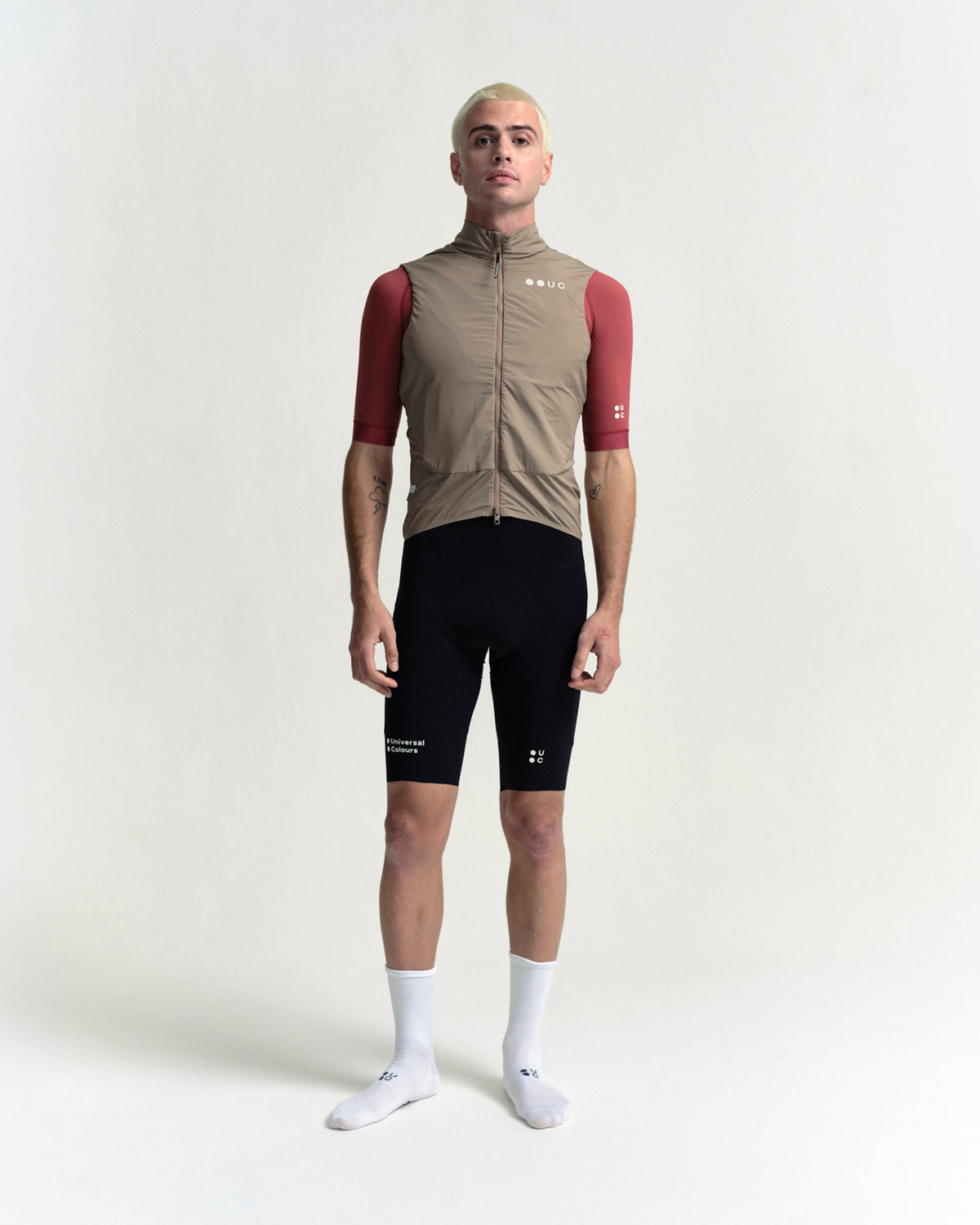 Model in the Men's Chroma Insulated Gilet in Walnut Brown, full-length view.