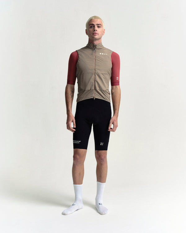 Model in the Men's Chroma Insulated Gilet in Walnut Brown, full-length view.