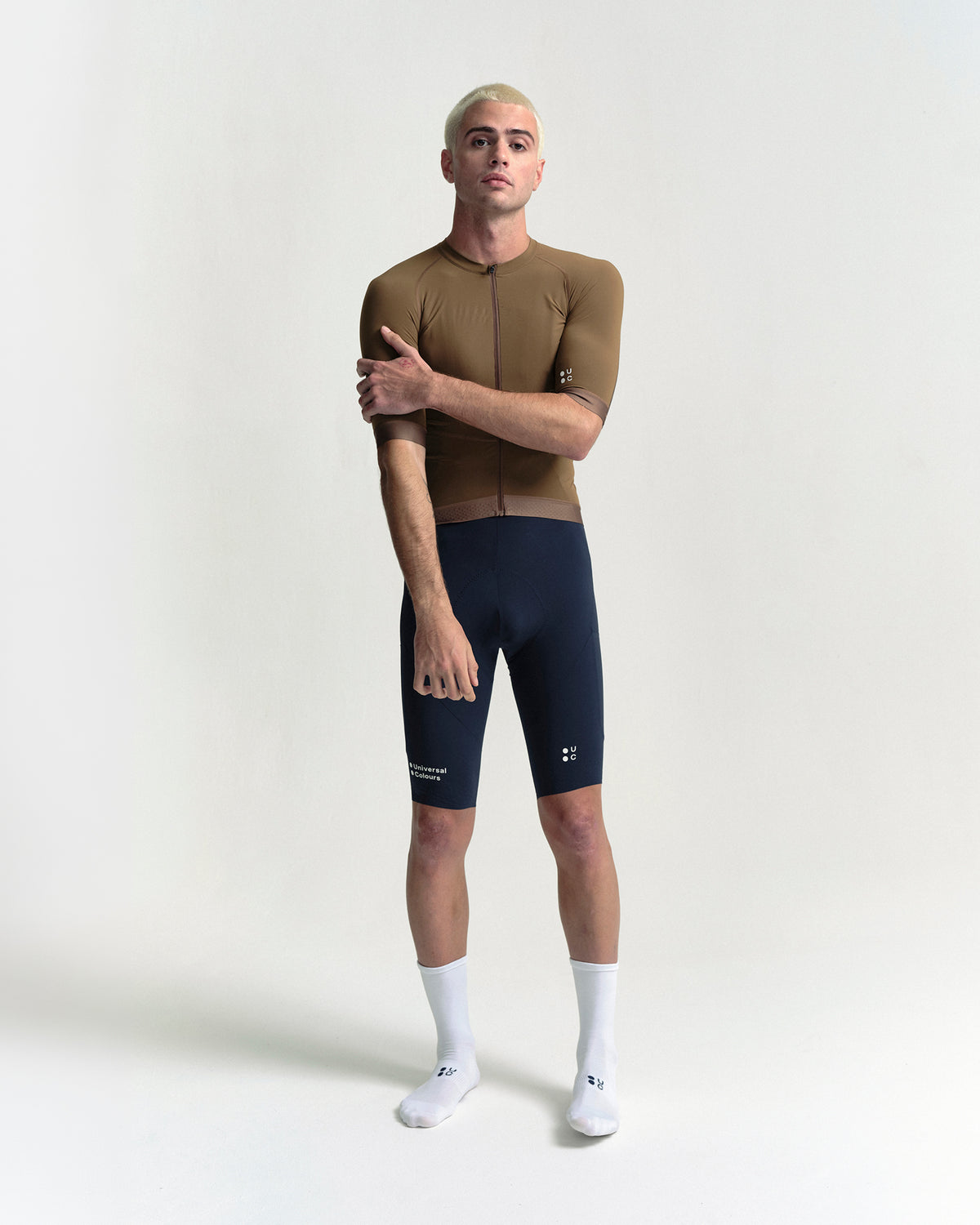 Model in the Men's Chroma Short Sleeve Jersey in Golden Brown, full-length view.