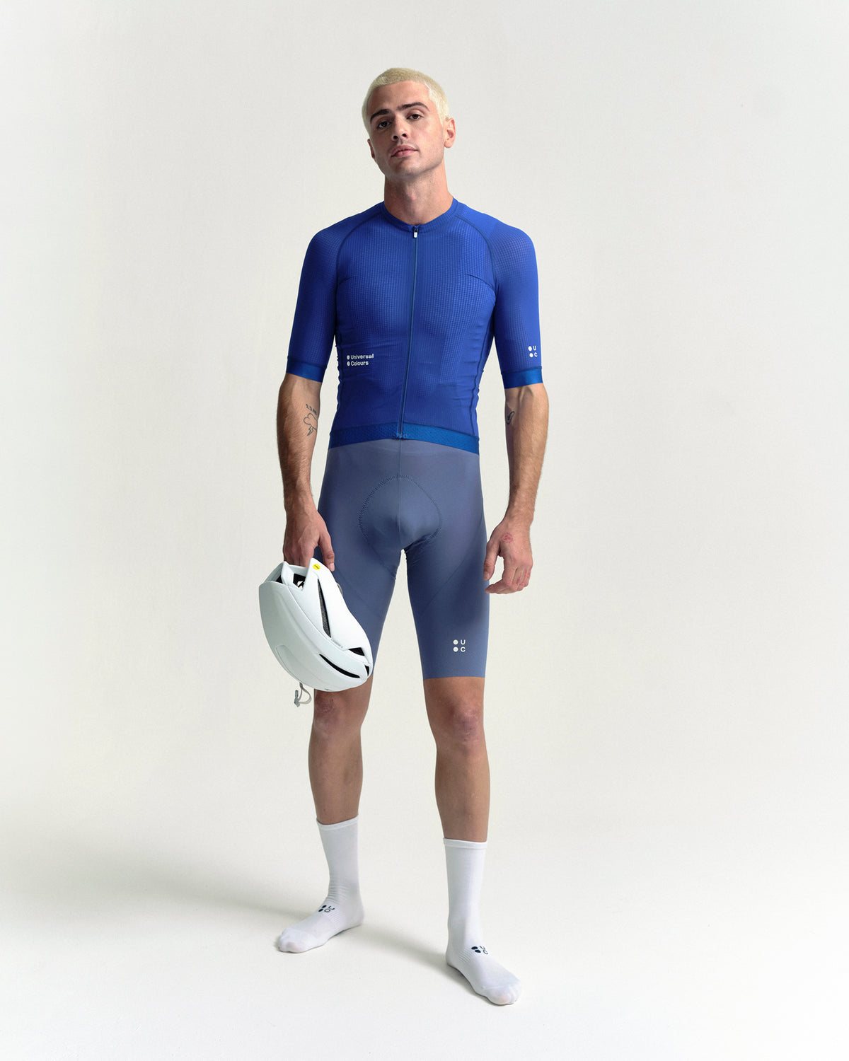 Model in the Men's Chroma Light Short Sleeve Jersey in Vivid Blue, full-length view.