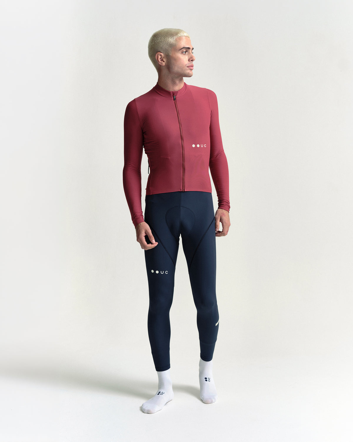 Model standing in the Men's Mono Long Sleeve Jersey in Apple Red, front view.
