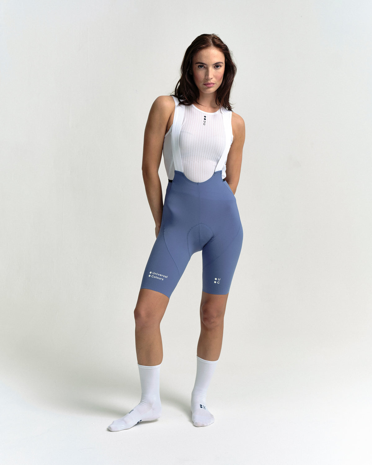 Model in the Women's Chroma Bib Shorts in Slate Blue, full-length view.