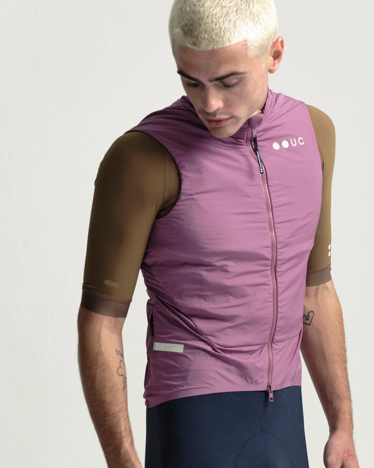 Model wearing the Men's Chroma Insulated Gilet in Dusty Rose.