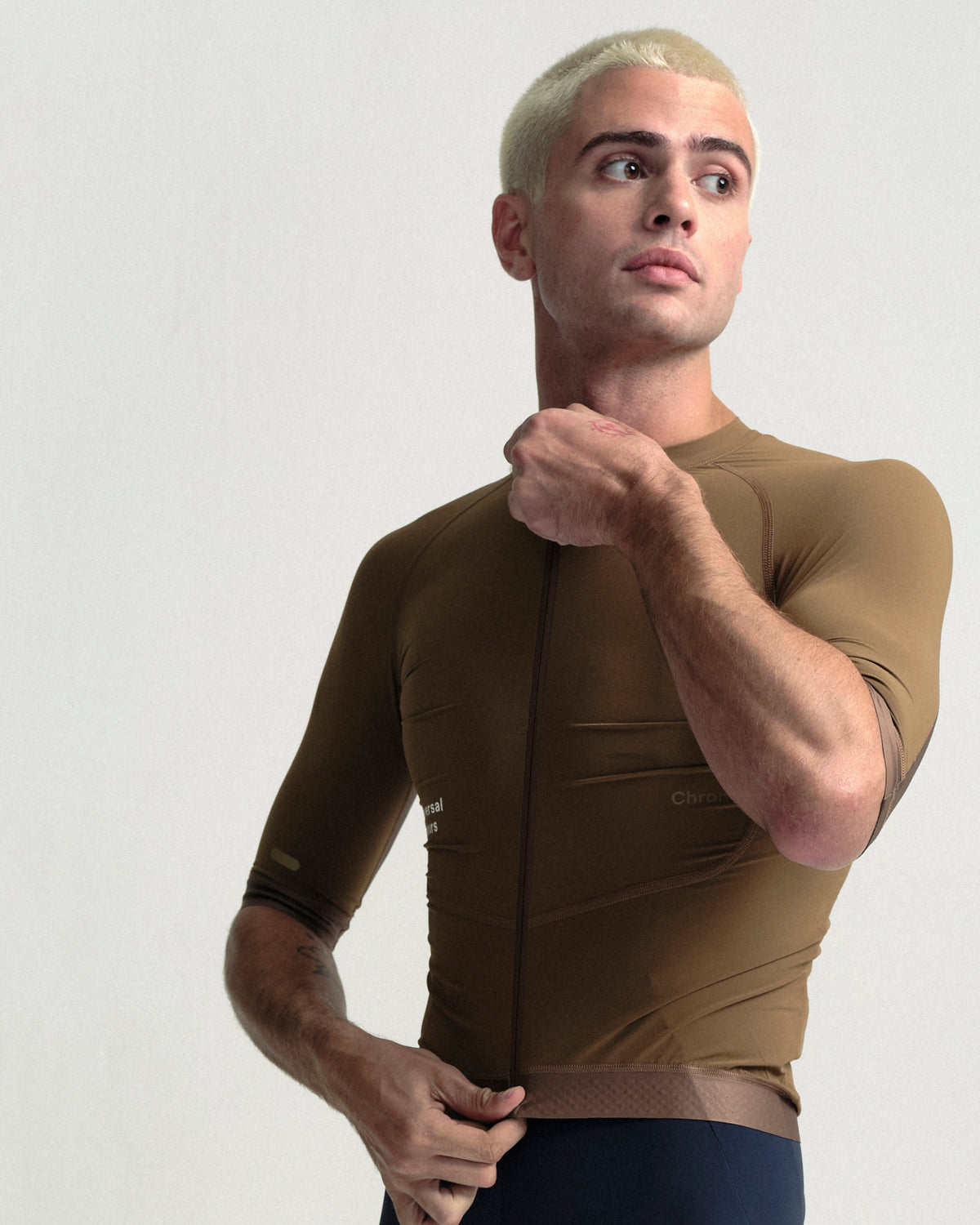 Model wearing the Men's Chroma Short Sleeve Jersey in Golden Brown.