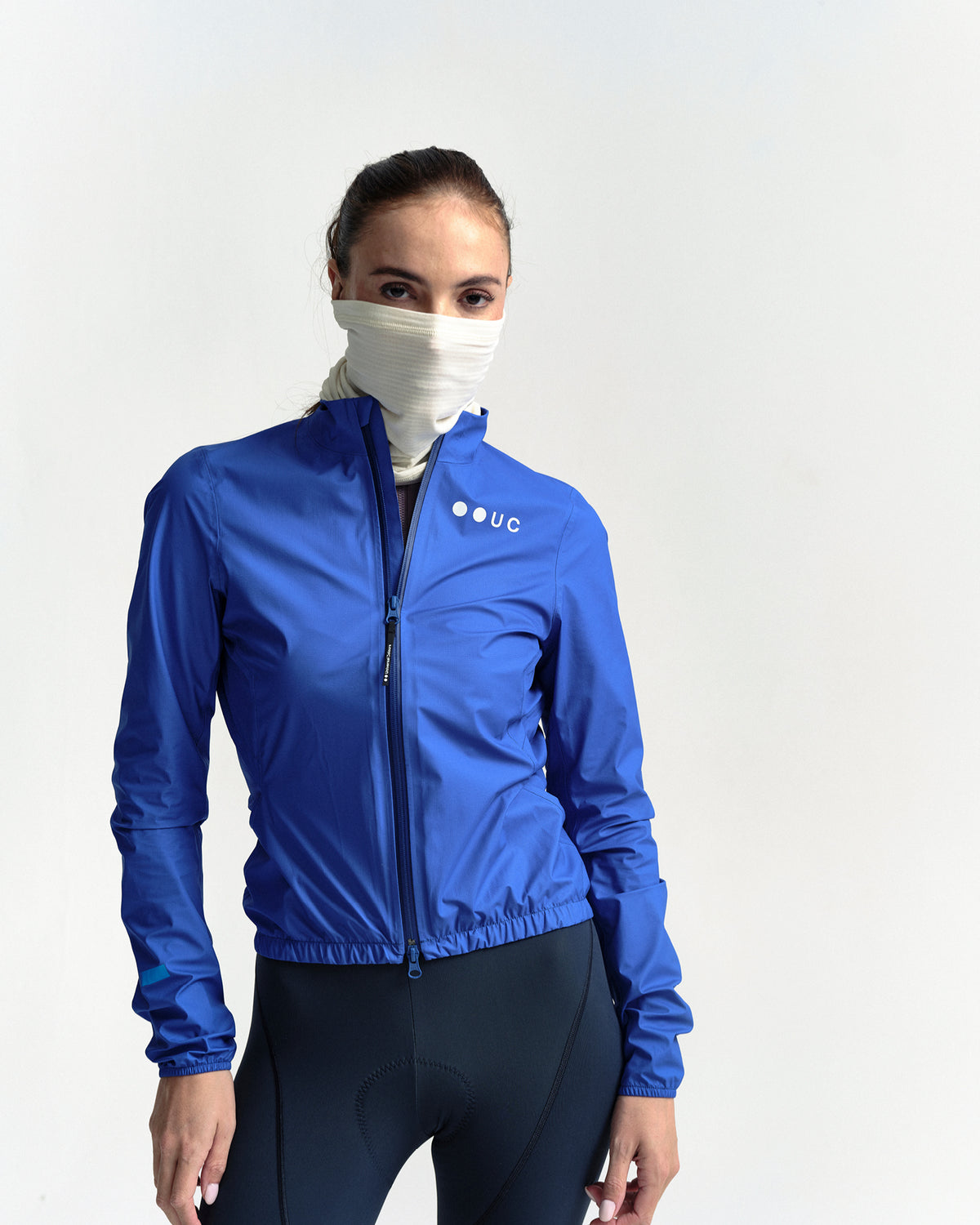 Model wearing the Polartec Neck Warmer in Off White.