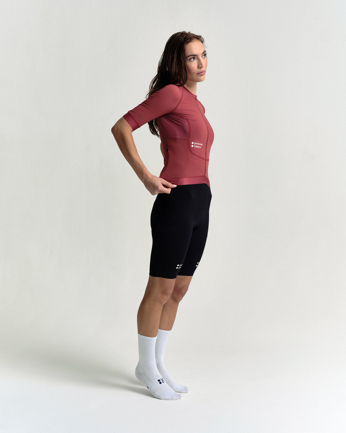 Model wearing the Women's Chroma Short Sleeve Jersey in Earth Red.