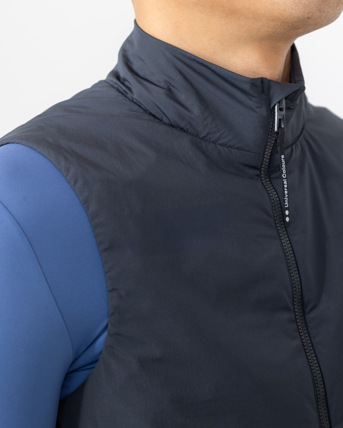 Close-up of the high collar on the Men's Chroma Insulated Gilet in Slate Grey.