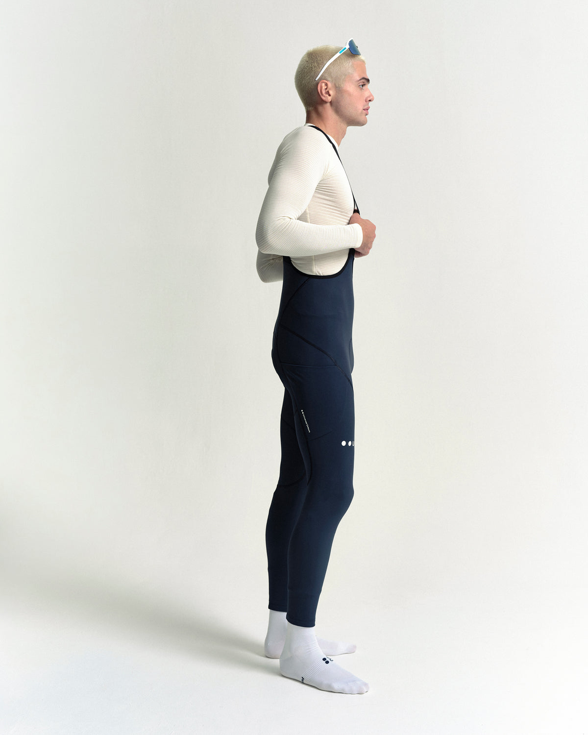 Model wearing the Men's Mono Cargo Bib Tight in Eclipse Navy.