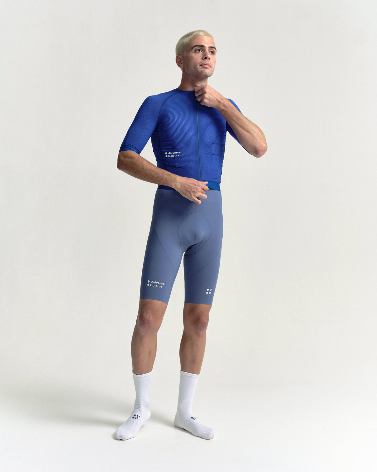 Model wearing the Men's Chroma Light Short Sleeve Jersey in Vivid Blue.