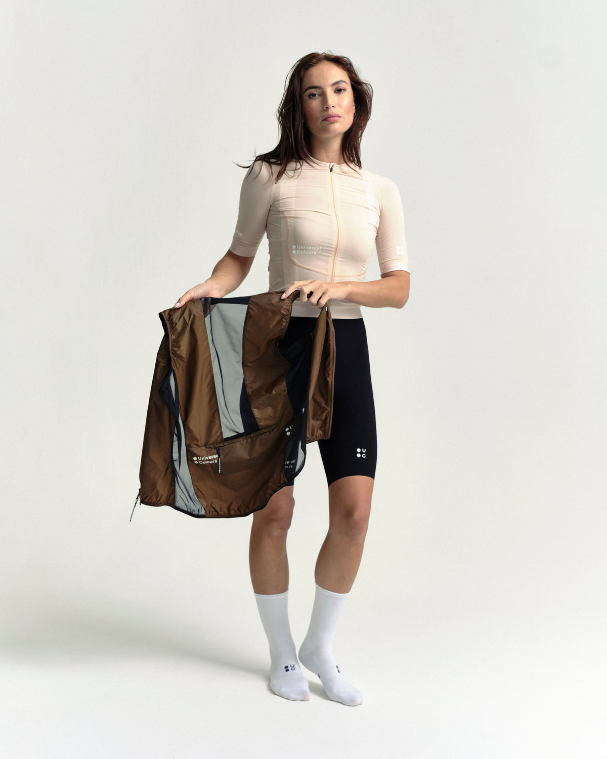 Model wearing the Women's Spectrum Gilet 2.0 in Honey Gold.