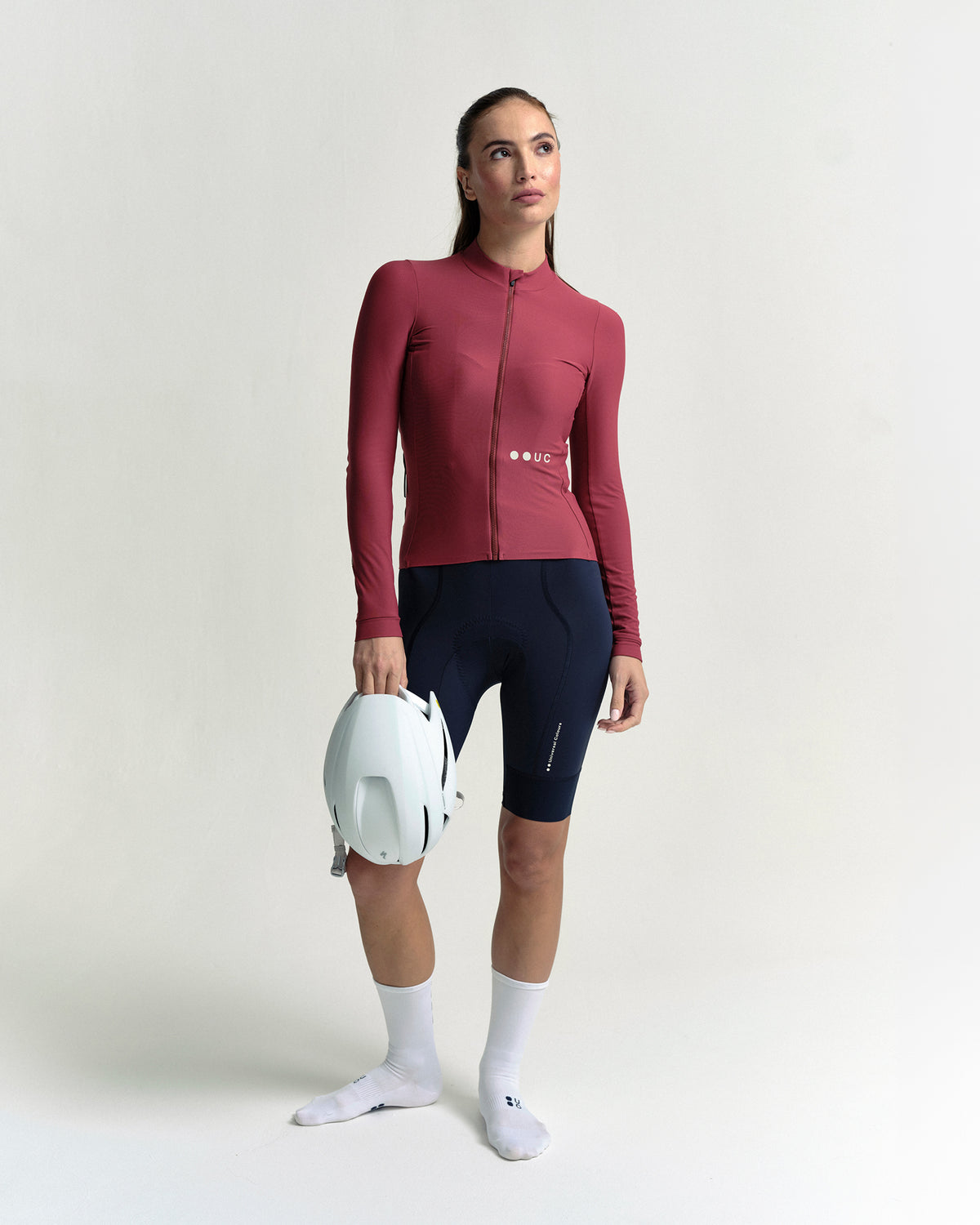 Model in the Women's Mono Long Sleeve Jersey in Apple Red, full-length view.