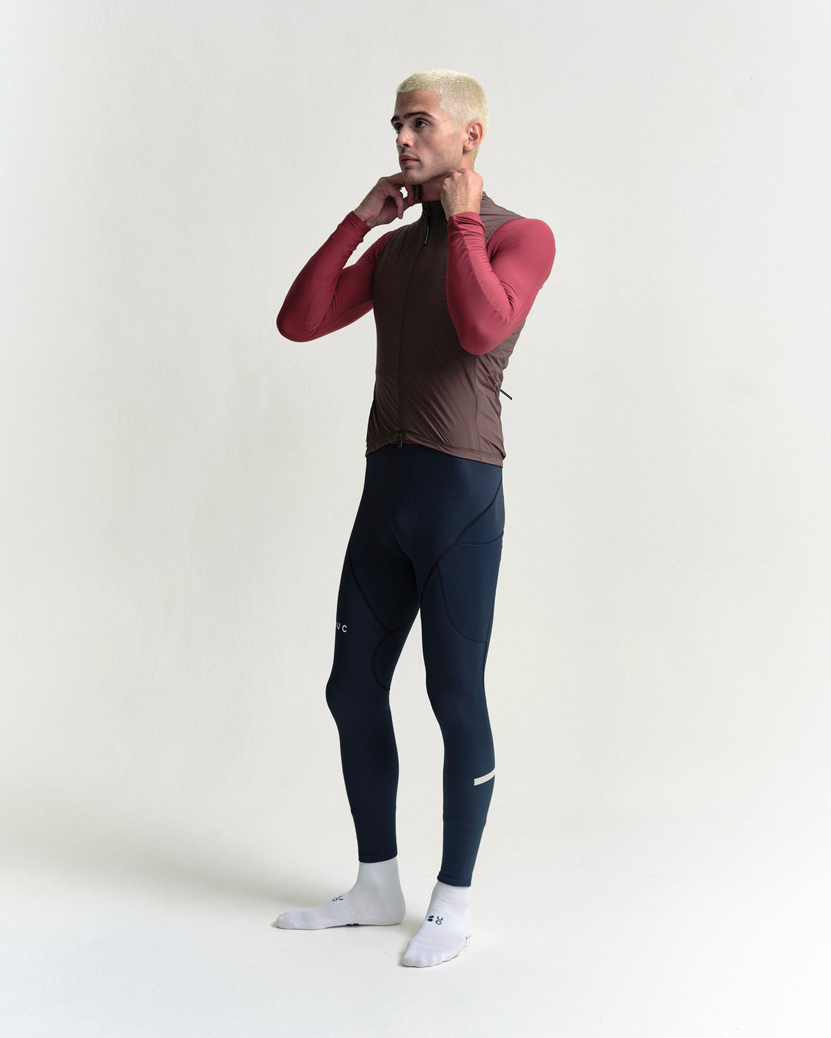 Model in the Men's Mono Gilet 2.0 in Stone Brown, full-length view.