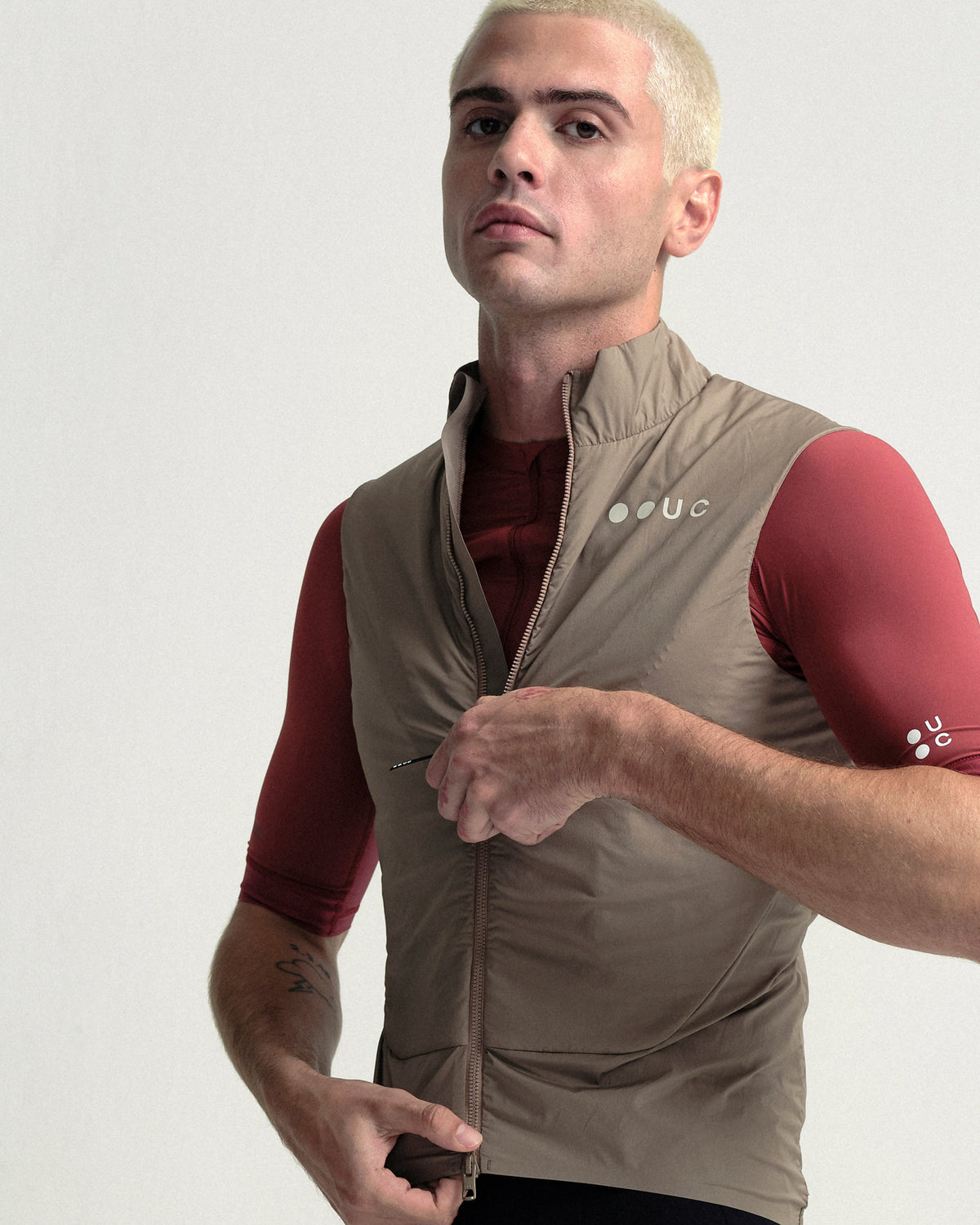 Model wearing the Men's Chroma Insulated Gilet in Walnut Brown.