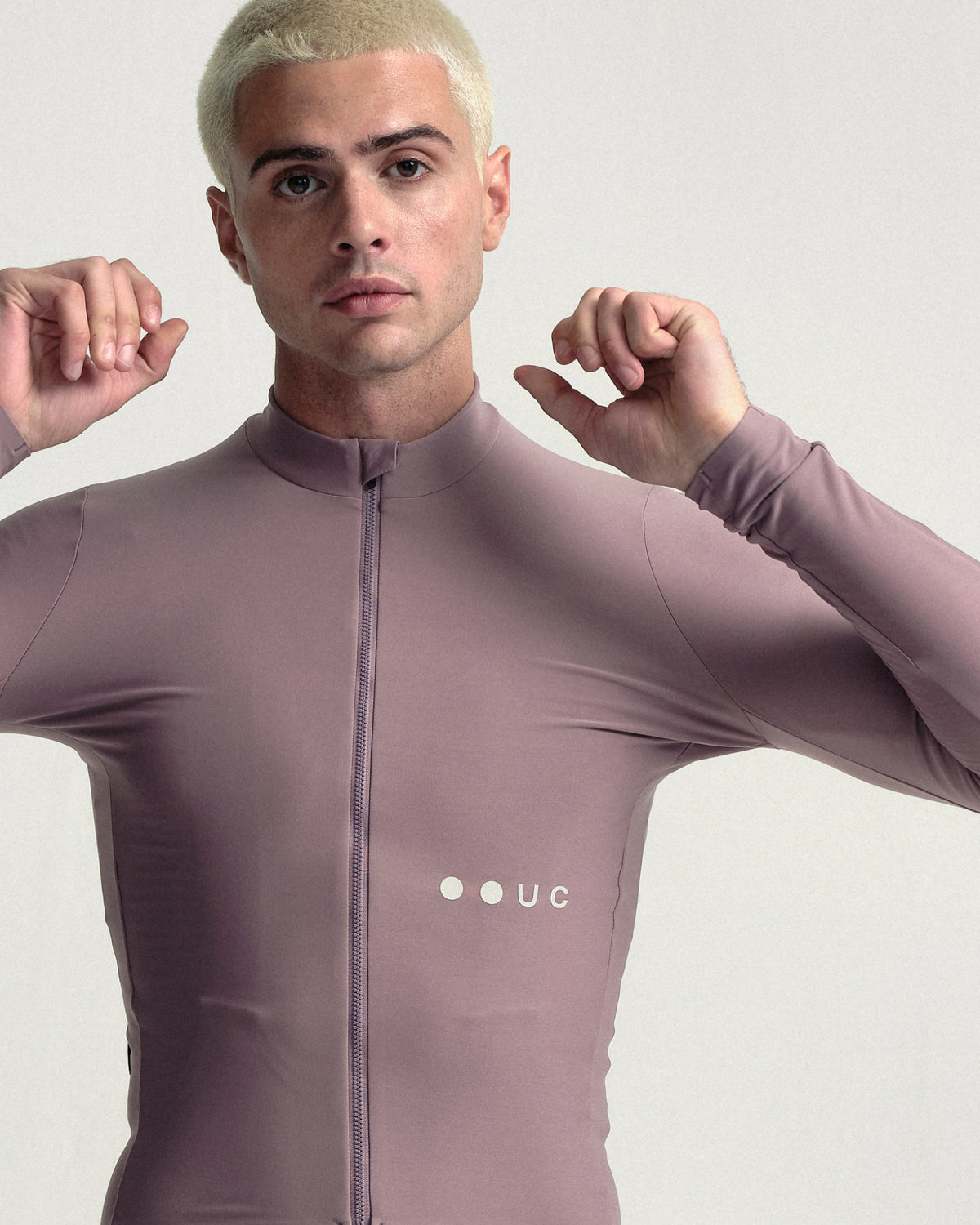 Model wearing the Men's Mono Long Sleeve Jersey in Mauve Mist.