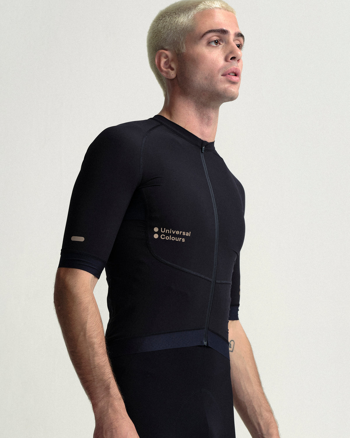 Model wearing the Men's Chroma Bib Shorts in Black/Bronze.