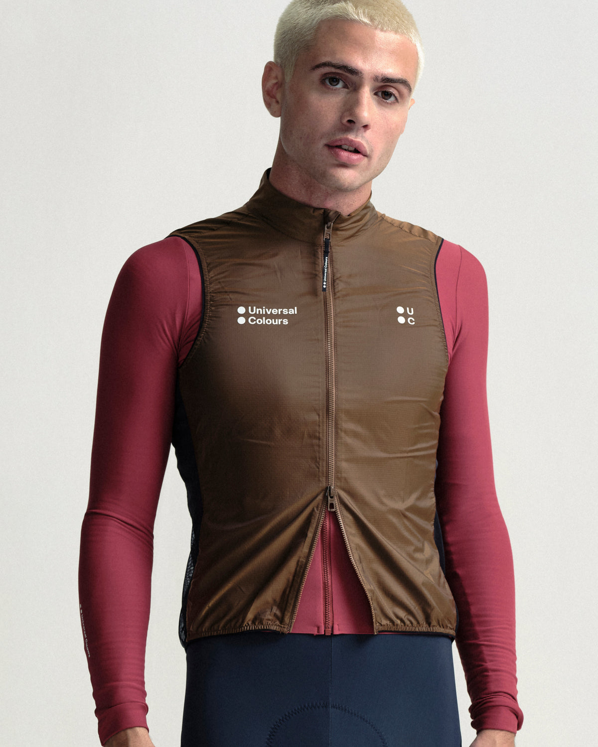 Model wearing the Men's Spectrum Gilet 2.0 in Honey Gold.