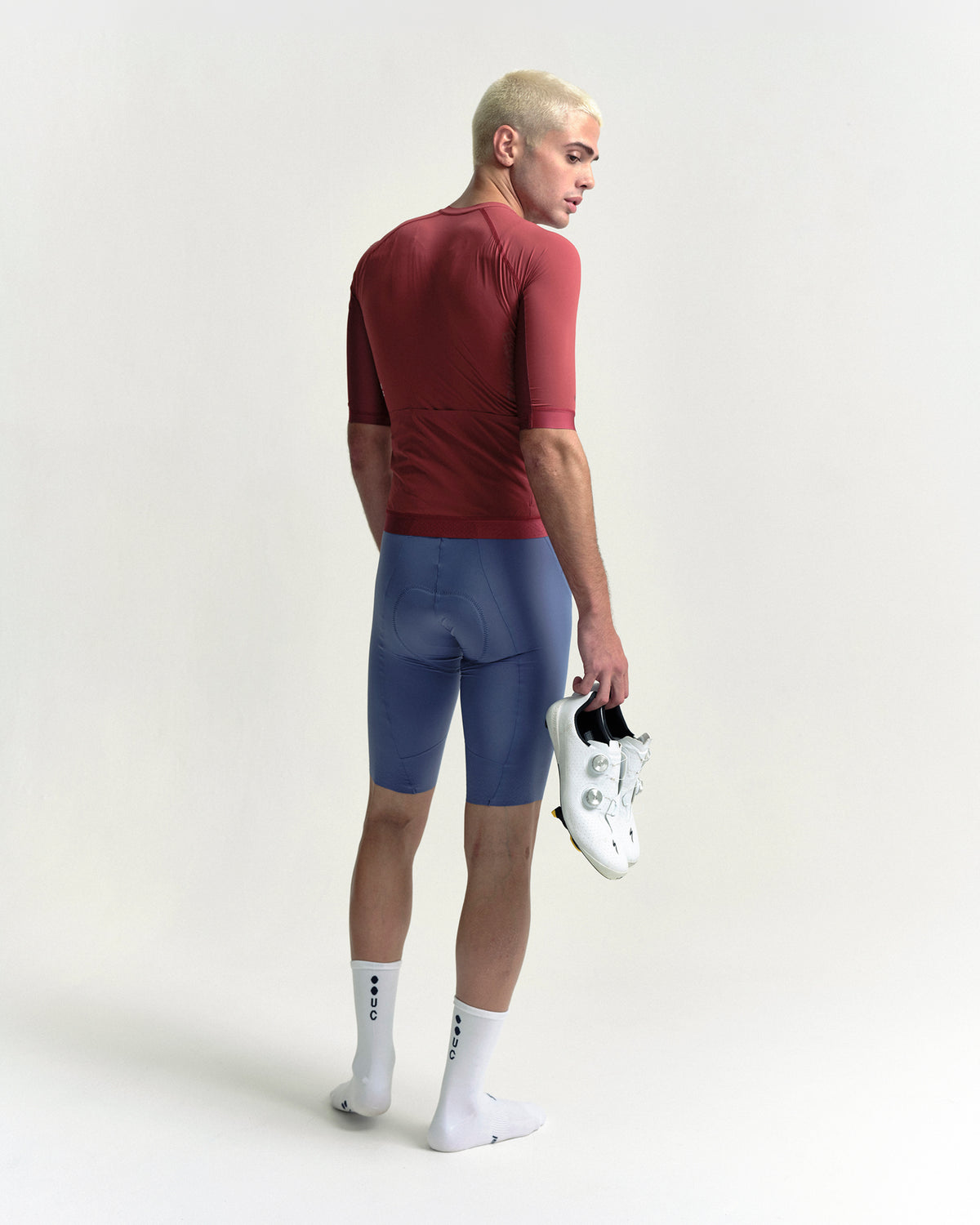 Model wearing the Men's Chroma Short Sleeve Jersey in Earth Red.