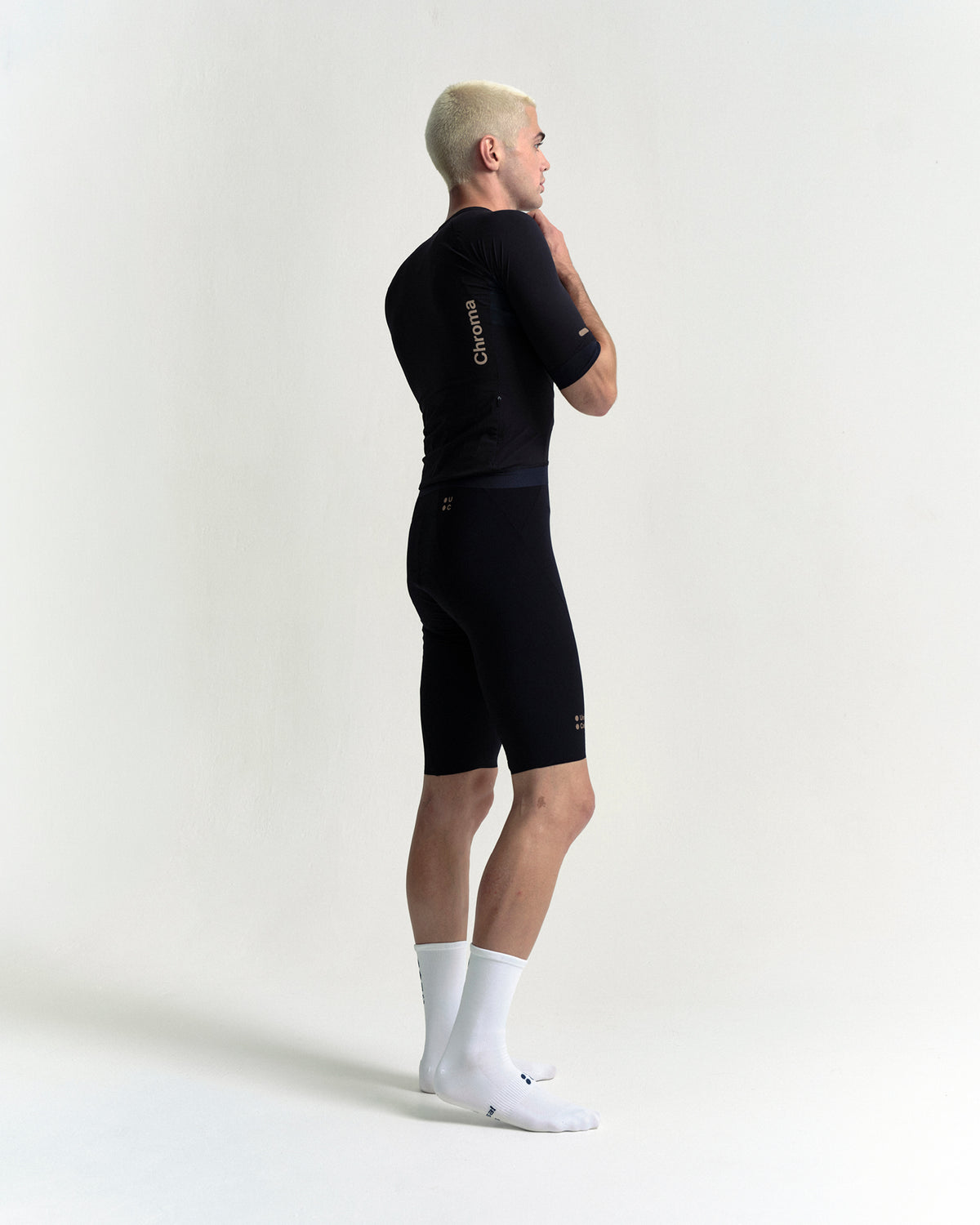 Model wearing the Men's Chroma Bib Shorts in Black/Bronze.