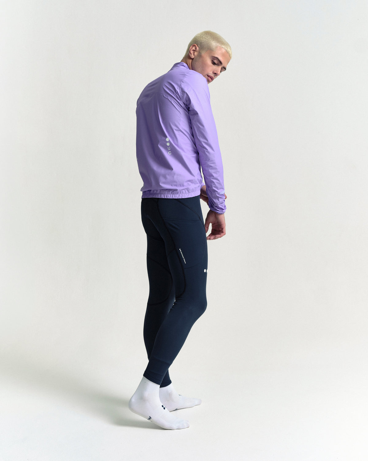 Model in the Men's Mono Rain Jacket in Cloud Lilac, full-length view.