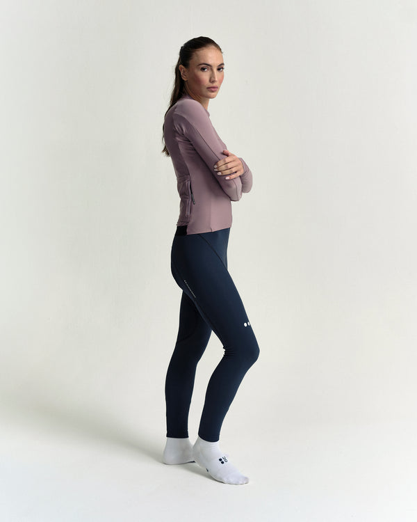 Model in the Women's Mono Long Sleeve Jersey in Mauve Mist, full-length view.