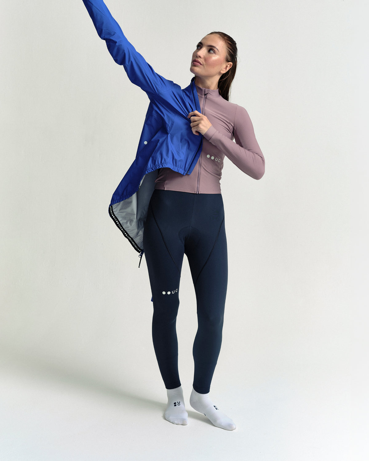 Model wearing the Women's Mono Rain Jacket in Vivid Blue.