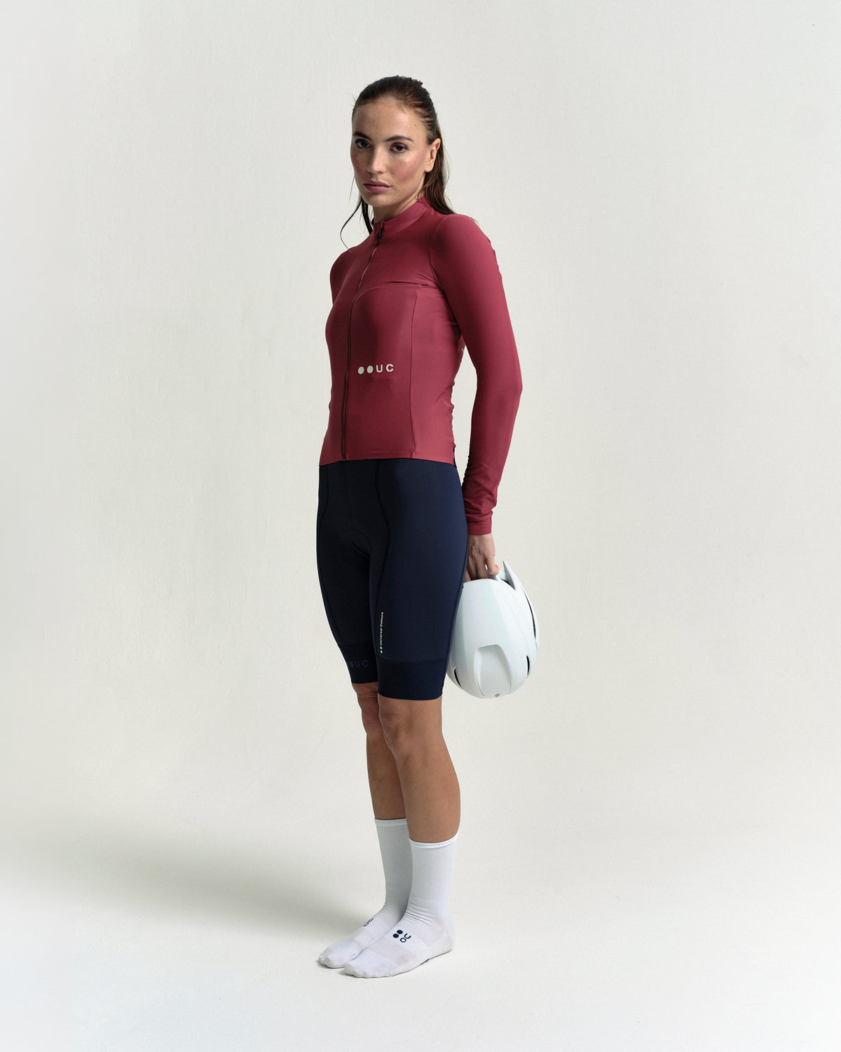 Model wearing the Women's Mono Long Sleeve Jersey in Apple Red.