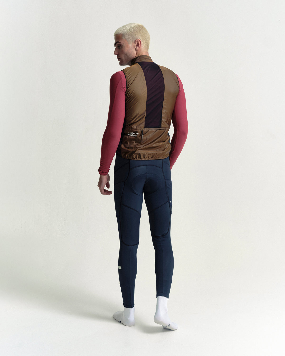 Model wearing the Men's Spectrum Gilet 2.0 in Honey Gold.