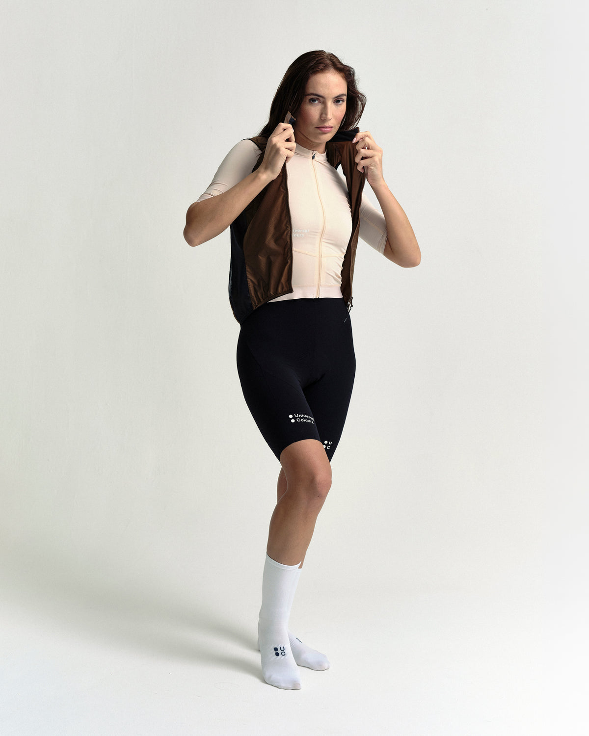 Model wearing the Women's Spectrum Gilet 2.0 in Honey Gold.